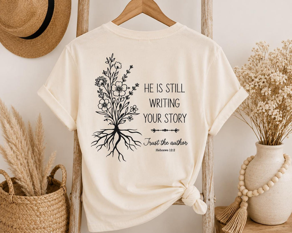 He Is Still Writing Your Story Comfort Colors Christian Shirt, Hebrews 12:2 Floral Design