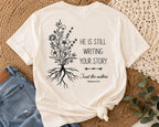 He Is Still Writing Your Story Comfort Colors Christian Shirt, Hebrews 12:2 Floral Design