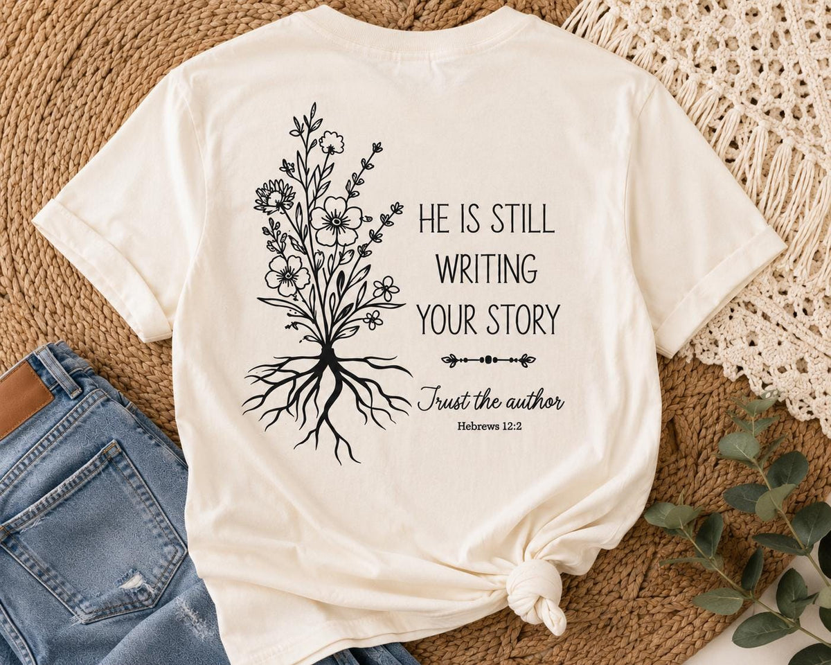 He Is Still Writing Your Story Comfort Colors Christian Shirt, Hebrews 12:2 Floral Design